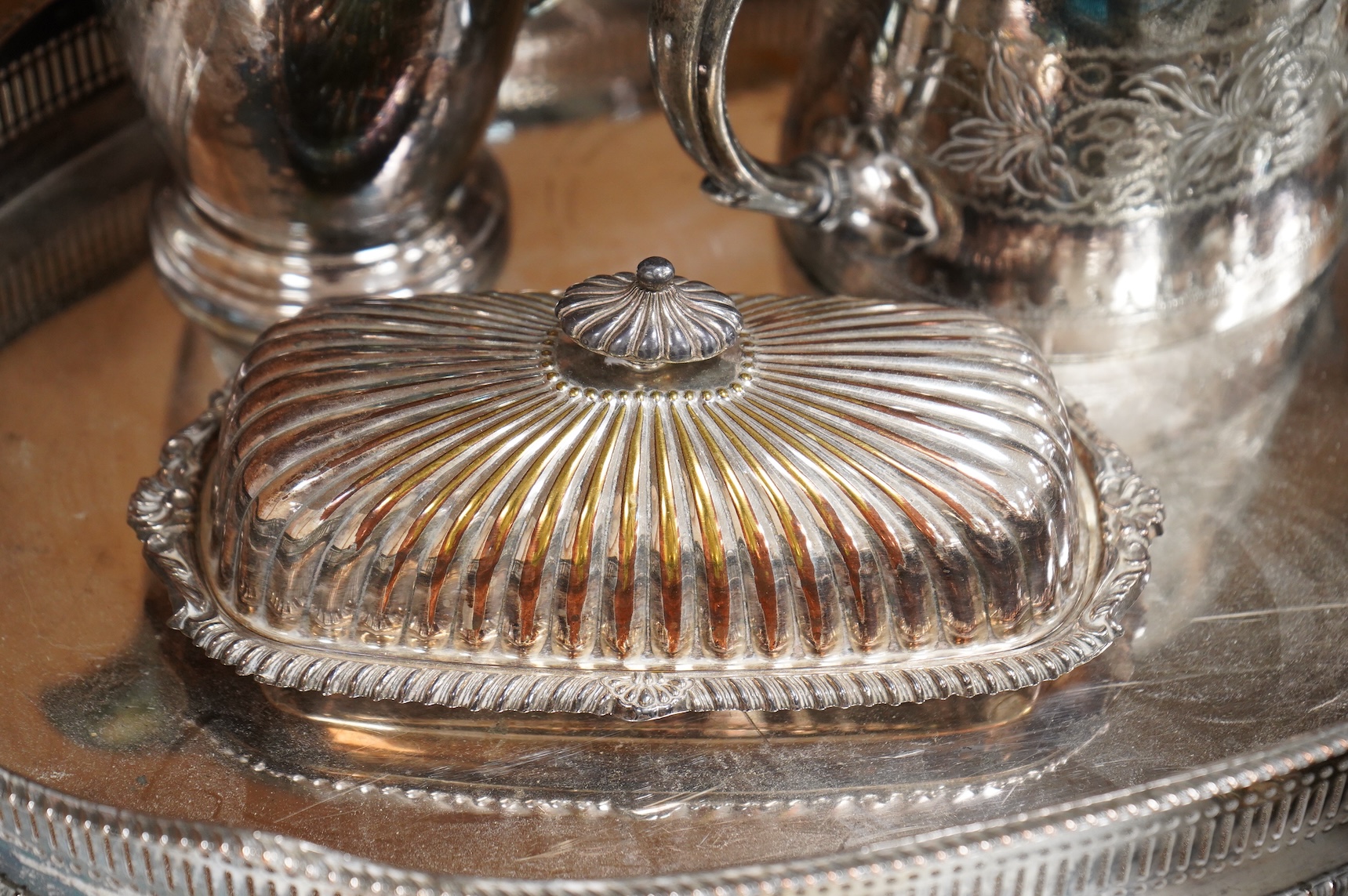 A quantity of plated wares to include a galleried tray, teapot, jug and bon bon dish with glass liner, largest 45cm wide